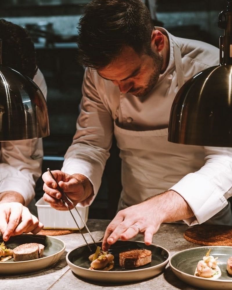 Chef plating at the Croupier Chef counter